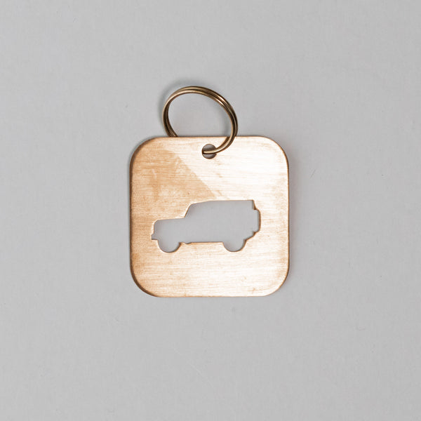 A DEFENDER SILHOUETTE KEY TAG aka THE BOTTLE OPENER