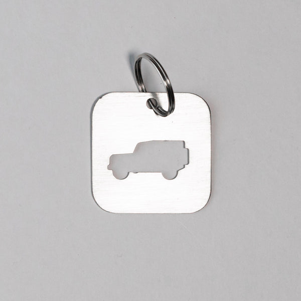 A DEFENDER SILHOUETTE KEY TAG aka THE BOTTLE OPENER