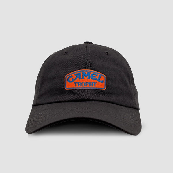 Black cap with Camel Trophy logo on a light gray background